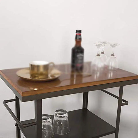 Heavy Duty Metal Industrial Rolling Cart With Three Roomy Shelves For Kitchen Storage Bar Setup And Home Organization Top Shelf with drinks and glassware.