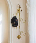 Knockout Brass Peacock Wall Hook S Shaped Coat And Hat Rack Fly Entryway Or Bedroom Setup with a hat hanging.