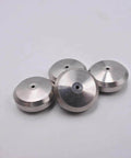 Four silver aluminum component seat seals with central hole for waterjet cutting machines.