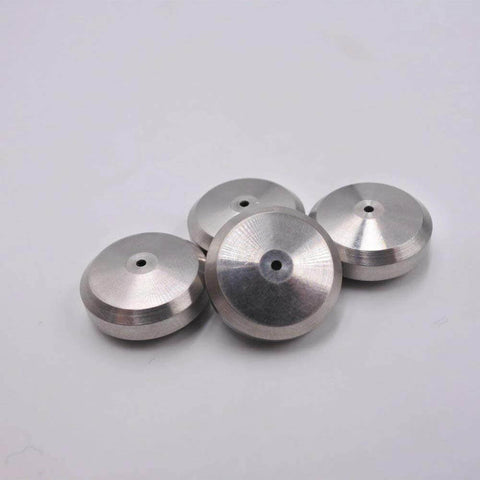 Four silver aluminum component seat seals with central hole for waterjet cutting machines.