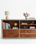 Knockout Aviator Sideboard Cabinet Drops That Aero Industrial Heat With Wraparound Weathered Brown Leather Riveted Silver Trim And Massive Storage Building A Solid 54 Inch Credenza Console Table For Any Cool Living Space showcasing books, globe, and lamp.
