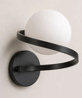 MAHGNTKCX Black Wall Sconce with Opal Glass Globe and Spiral Metal Frame, close-up view showing the globe and spiral design.