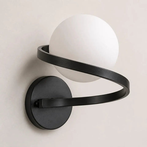 MAHGNTKCX Black Wall Sconce with Opal Glass Globe and Spiral Metal Frame, close-up view showing the globe and spiral design.