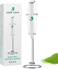 Electric Matcha Whisk And Milk Frother With One Button Operation for Barista Style Foamy Green Tea next to packaging and matcha powder