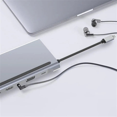 Slick 12 In 1 Type C Hub Docking Station With Crisp 4K Display Dual Gigabit Ethernet Lan Ports PD Quick Charge Aluminum Body connected to laptop.