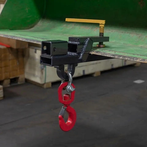 Clamp On Tractor Bucket Hitch Receiver Adapter With Chain Hook And Lifting Ring For Front Bucket Lips Two Inch Receiver 1100 Lb Towing Capacity Easy Slide On Clamp On Design attached to green tractor bucket.