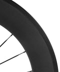 Close-up of Carbon Road Wheelset 700c Matte Finish Clincher With 88mm Rim Brake showing deep rim profile and spoke detail.