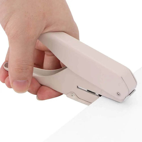 Hand using Mushroom Hole Puncher 6 Sheet A4 Capacity, mushroom-shaped paper puncher for office, school, and craft, 15 by 8.5 cm tool
