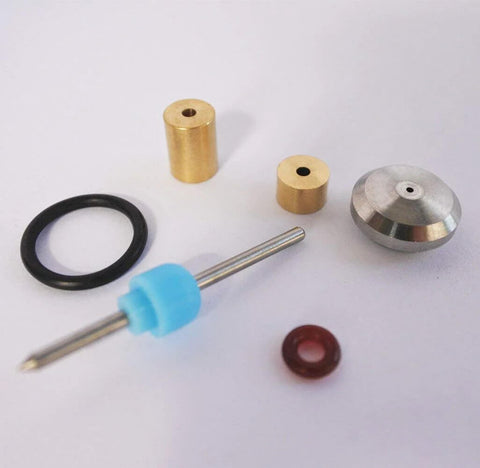 Waterjet on/off valve repair kit parts: brass bushings, steel valve stem with blue spacer, black O-ring, red gasket.
