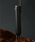 No Fuss WDT Needle Tool For Espresso Brewing Retractable Telescopic coffee ground distributor on brown coffee grounds.