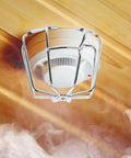 Fire Sprinkler Head Guard Protective Cover Cage Ceiling Impact Resistant Shield protecting sprinkler head in smoky environment.