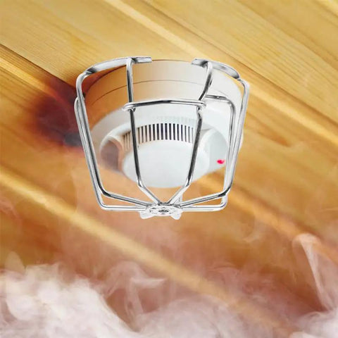 Fire Sprinkler Head Guard Protective Cover Cage Ceiling Impact Resistant Shield protecting sprinkler head in smoky environment.
