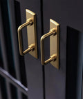 Close-up of Champagne Bronze Cabinet Pulls With Escutcheon Backplates, Sleek 3 Inch Hole Center Modern Kitchen Drawer Handles