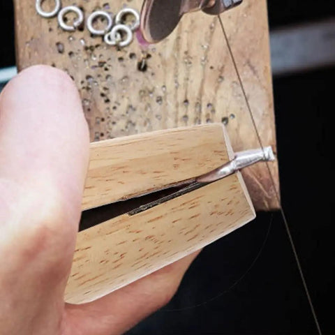 Close-up of Wooden Ring Clamp Tool Set, 2Pcs Jewelry Wire Clamp For Ring Bending And Polishing in use, showing wood vise.