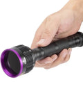 Hand holding Beast Mode 20W 365nm UV Flashlight With USB Rechargeable Battery Battery Included Black Light.