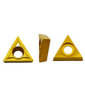 Three gold triangular carbide turning inserts with center holes for metal cutting.