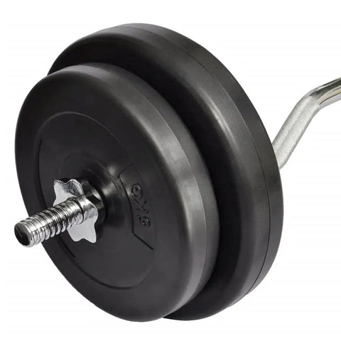 Close-up of a weight plate on the ergonomic 47.2-inch barbell from the Pump Up Your Workouts With This Super Versatile 66.1 Lb Curl Bar With Weights Set