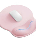 Light pink ergonomic gel wrist rest mouse pad for desk, non-slip, contoured support, large 10.6 x 9 inch for comfy work and fatigue relief.