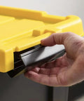 Close-up of ergonomic handle on a 12 Gallon Heavy Duty Storage Tote Set of 3 Black Plastic Bins Featuring Secure Yellow Lids.