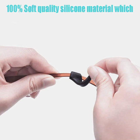 Hands holding black silicone Anti Slip Eyeglass Ear Grips Set With Soft Silicone Retainers For Glasses, Sunglasses, And Specs