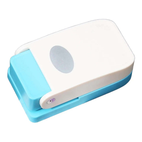 Dope Tiny Paper Punch Hole Puncher For Scrapbooking And Photo Albums, Oval Shape, Acrylic And Metal Cutter, shown in side view