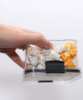 Side view of transparent plastic Sumgsn keyboard switch storage box (460ml) filled with white and orange switches.