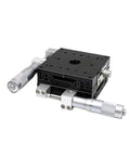 Pro Grade 100x100mm Manual Linear Stage with LY100-R LY100-L LY100-C displacement platform, black tabletop, two silver micrometers visible.