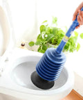 Heavy Duty Bad Boy Manual Toilet Plunger With Vacuum Suction Cup For Deep Pipe Dredging And Stubborn Drain Clogs in use at toilet bowl.