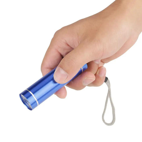 Hand holding blue UV light tool from Pro Level Solder Flux Paste Kit For DIY PCB Repair And BGA Welding, Anti Short Circuit Oil Flux For Wiring.