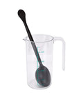 Artisan Manual Siphon Coffee Maker Featuring Sturdy Heatproof Glass Carafe For Precise Extraction Flow And Fully Custom Steeping Cycles That Hit Different Daily On Your Kitchen Counter with a measuring cup and a black spoon.