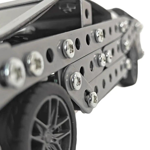 Detail view of Stainless Steel Model Car Kit For Adults A Do It Yourself 3D Puzzle And Mechanical Engineering Toy, bolts and wheel