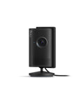 Wireless Indoor Security Camera With Retinal 2K Video And 6X Optical Zoom For Crisp True Color Footage Day Or Night Straight Up Solid Home Safety Monitor Black on a stand.