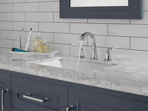 Geist Chrome 8 Inch Widespread Bathroom Sink Faucet For 3 Hole Vanities Push Pop Drain Easy Install Wrench Free Premium Brass Construction on marble vanity, side view.