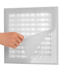 Hand applying DIY air vent filter to HVAC grille with Complete Air Vent Filter Kit For Your HVAC And Home Ducts, DIY Friendly.