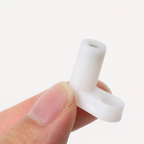 Close-up of a white plastic corner bracket L shape brace for shelves and furniture support, smooth burr-free finish, heavy duty.