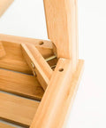 Close-up of the Sturdy Bamboo Shower Bench Seat With Storage Shelf Organizer Waterproof Bathroom Chair corner joint showing screws.