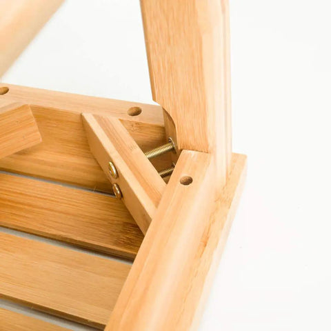 Close-up of the Sturdy Bamboo Shower Bench Seat With Storage Shelf Organizer Waterproof Bathroom Chair corner joint showing screws.