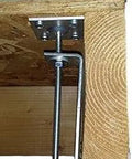 Squeak Ender Underfloor Squeak Eliminator Brackets Kit Nine displayed attached to wood joist beneath subfloor for stability.