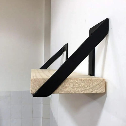 Heavy Hitter Iron Corner Brackets For Floating Shelves built tough supporting a wooden shelf in matte black finish.