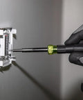 14-In-1 Electronic Precision Screwdriver Kit with 8 Tips being used to tighten a screw in an electrical panel.