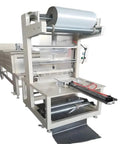 Fully Automatic Sleeve Shrink Wrapping Machine For Bottles Cups And Cans With Pe Plastic Film Tamper Proof Heat Seal Packaging Machine view with film roll and sealing area.