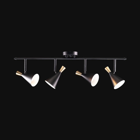 Dope Lofty Industrial Four Light Track Lighting Fixture With Pivoting Heads In Matte Black And Brass Accents on black background