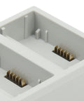 Close-up of battery slots in the Three Port Drone Charging Station For Mini 3 Pro On The Go Fast PD Battery Hub with Power Bank Charging.