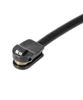 Close-up of black brake pad wear sensor with braided cable and metal contact