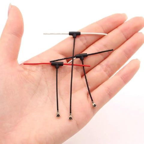 Dual ELRS 2.4GHz Mini T Antenna Pack IPX1 UFL 40mm 70mm Red in hand, showing ultra lightweight 2.6g, durable for EP1 EP2 Nano FPV Drones.