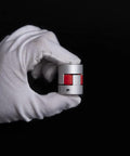 Beefy Durable Aluminum Flexible Shaft Coupling D25 L30 For 5 To 8mm Shafts in gloved hand, showing red dampening element.