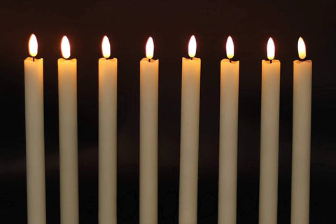 Eight flameless ivory taper candles, 9.64 inches tall, with warm flickering LED light, real wax look for home and wedding decor.