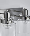 Close-up of Dope Brushed Nickel Three Light Bath Vanity Wall Sconce With E26 LED Bulbs, showing glass shades and brushed nickel finish.