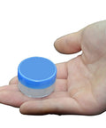 Small container of White Lithium Grease for Machinery and Gears, High and Low Temperature Resistance held in hand