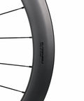 Close-up of 50mm Matte Carbon Road Wheelset With Center Lock Disc Brakes 700c Beefy 28mm Rim Fits 25C To 38C Tires UCI Approved